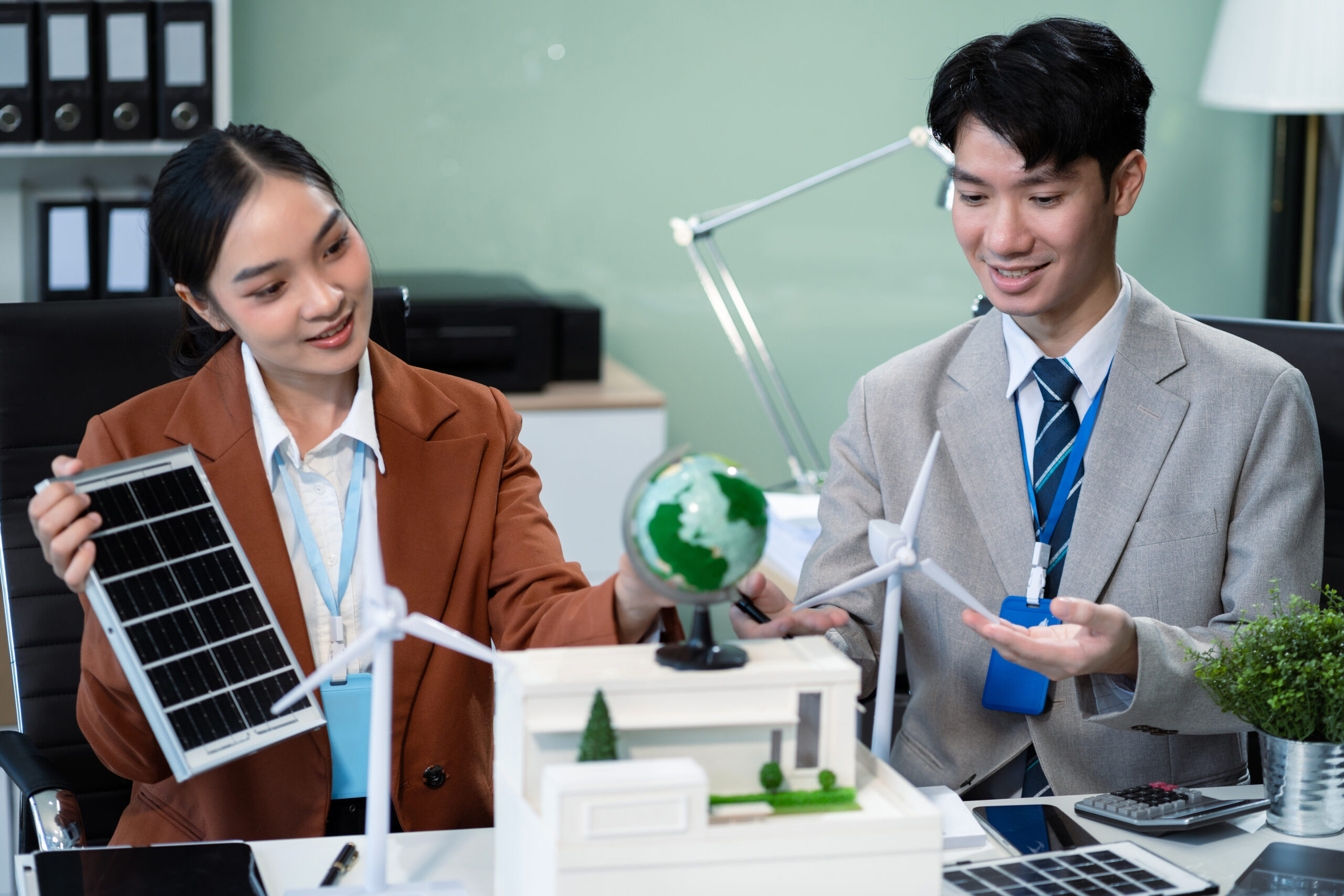 engineer teamwork meeting, with partner on model building at company office working technology, Renewable energy-based green businesses and global warming.