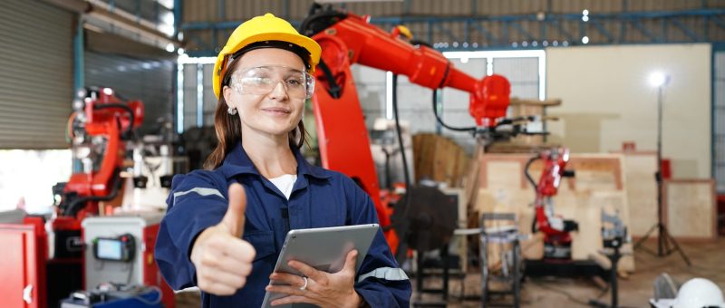 female industrial worker working with manufacturing equipment in a factory female industrial worker working with manufacturing equipment in a factory